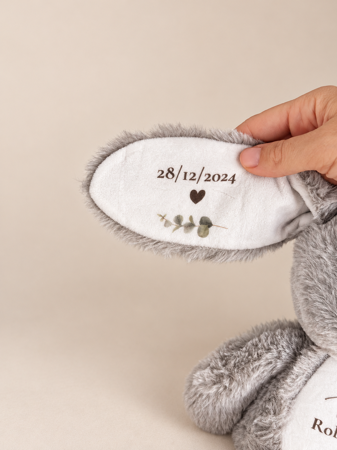 Bunny ear printed with date of birth